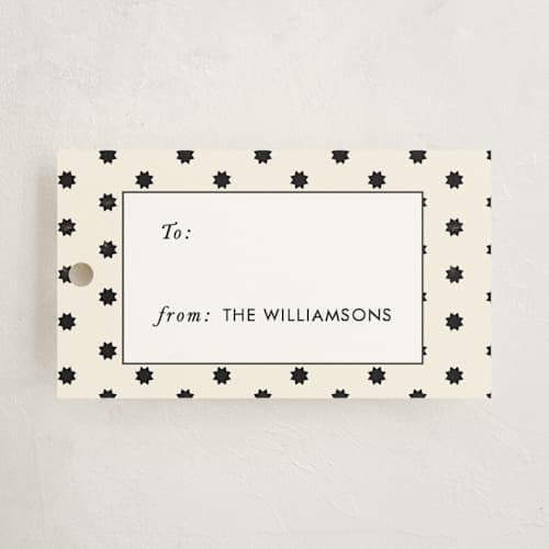 This is a cream gift tags with standard by Rebecca Durflinger called geo stars printing on signature in tag