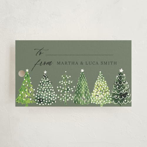 This is a snow gift tags with standard by Rosana Laiz Blursbyai called decorated christmas trees printing on signature in tag