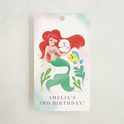 This is a lilac kids gift tags with standard by Itsy Belle Studio called disney's little mermaid shellebrate! printing on signature in tag