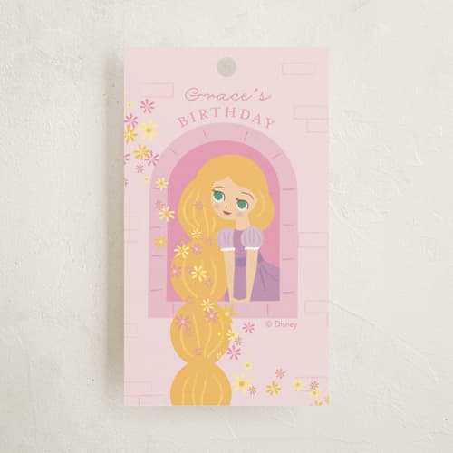 This is a strawberry kids gift tags with standard by Angela Thompson called disney's rapunzel tower printing on signature in tag