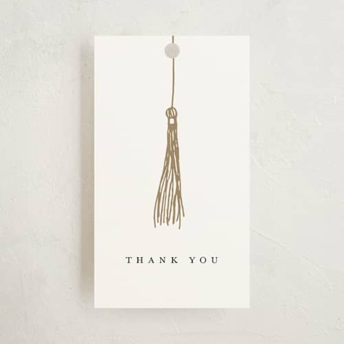 This is a pearl graduation tags with standard by Katy Shen called turning the tassel printing on signature in tag