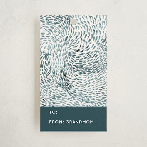 This is a teal gift tags with standard by Yaling Hou Suzuki called indigo wave printing on signature in tag