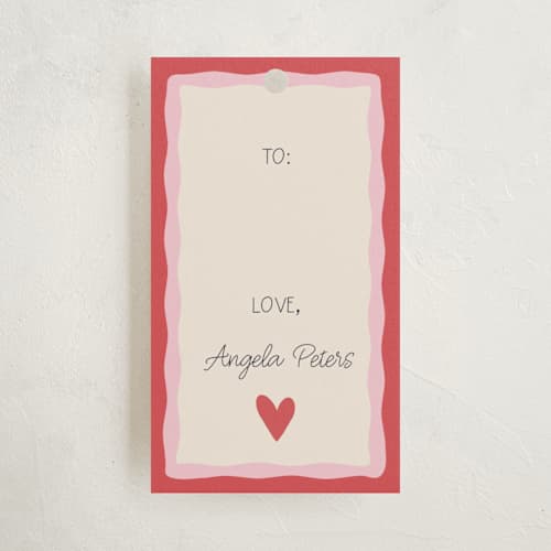 This is a heart gift tags with standard by Tina Faselli called a little love printing on signature in tag