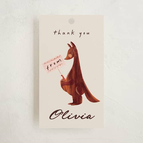 This is a cream baby shower favor tags with standard by Gwen Bedat called kangaroo pop printing on signature in tag