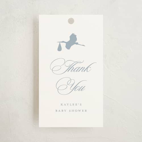 This is a dusty blue baby shower favor tags with standard by Stacey Meacham called storybook stork printing on signature in tag