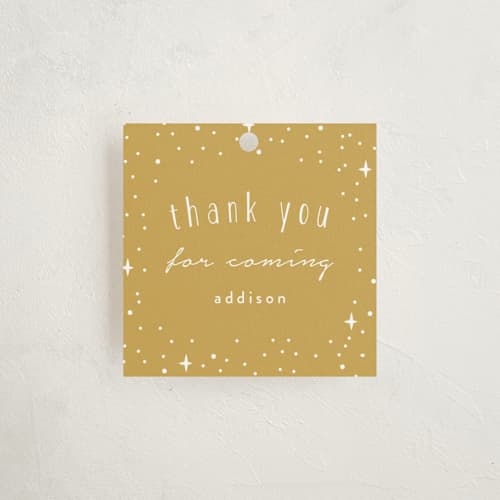 This is a gold kids gift tags with standard by Angela Garrick called pixie printing on signature in tag