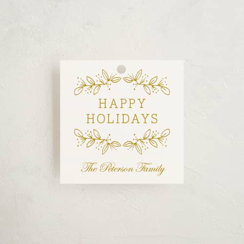 This is a golden gift tags with standard by Oscar and Emma - Karly Depew called joyful season printing on signature in tag