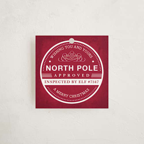 This is a crimson gift tags with standard by Kristen Smith called north pole approved printing on signature in tag