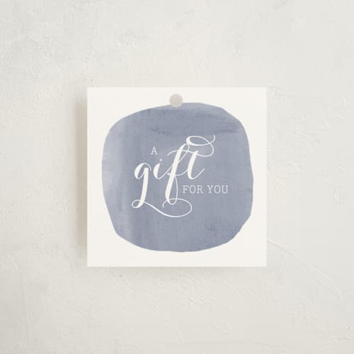 This is a lilac gift tags with standard by Penelope Poppy called simply baby printing on signature in tag