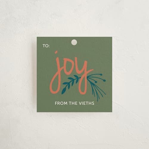 This is a teal gift tags with standard by Allison Dowlen called wrapped with joy printing on signature in tag