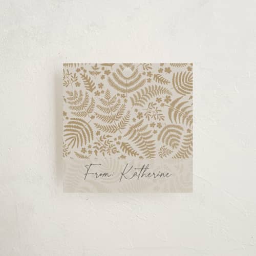 This is a gilded gift tags with standard by Mercedes called gold ferns printing on signature in tag