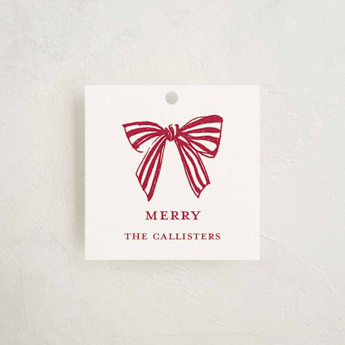 This is a candy cane gift tags with standard by Mere Paper called stamped with a bow printing on signature in tag