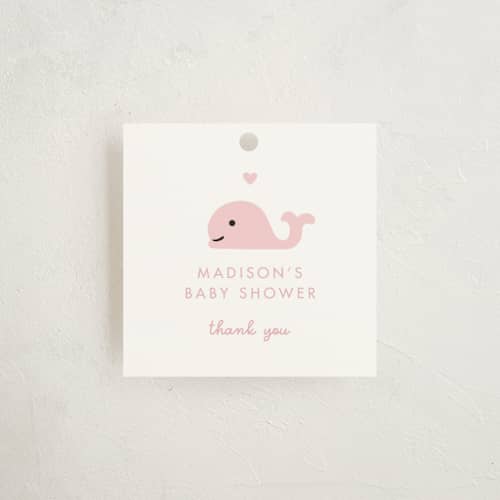 This is a baby pink baby shower favor tags with standard by mo kelley called baby whale on the way printing on signature in tag