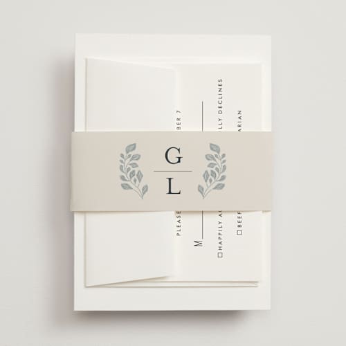 This is a dusty blue belly bands with standard by Jen Owens called embroidered printing on signature text in belly band