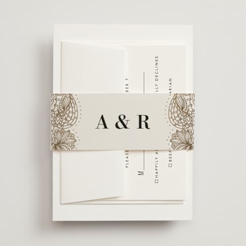 This is a champagne belly bands with foil pressed by Oma N. Ramkhelawan called elegant henna printing on signature text in belly band