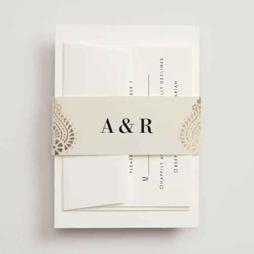 This is a champagne belly bands with foil pressed by Oma N. Ramkhelawan called henna stamp printing on signature text in belly band