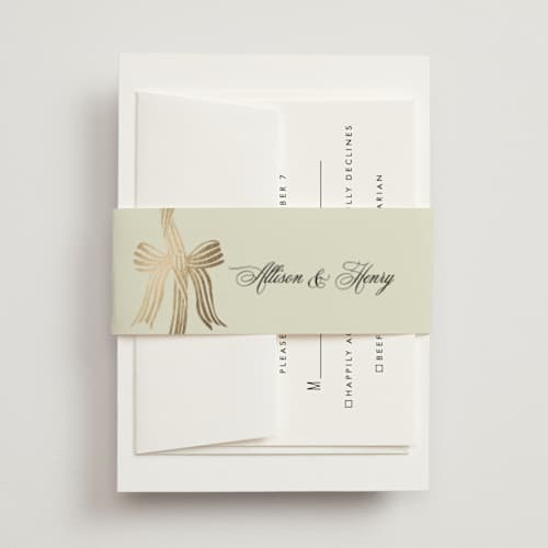 This is a champagne belly bands with foil pressed by Chris Griffith called all tied up printing on signature text in belly band