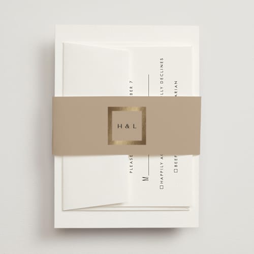 This is a latte belly bands with foil pressed by Stacy Maalouf called framed photo printing on signature text in belly band