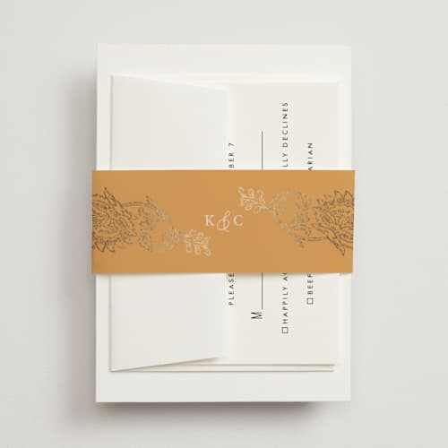This is a ochre belly bands with foil pressed by Hannah Bowman called marigold printing on signature text in belly band