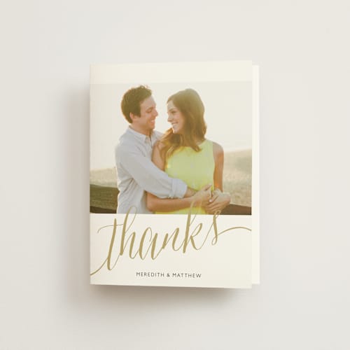This is a gold wedding thank you cards with standard by Erin Deegan called raise a glass printing on strathmore in standard