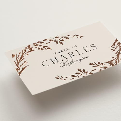 This is a almond wedding place cards with foil pressed by Erin L. Wilson called trailing vines printing on signature in placecard