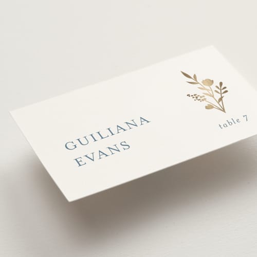 This is a dusty blue wedding place cards with foil pressed by Jennifer Postorino called wildflower printing on signature in placecard