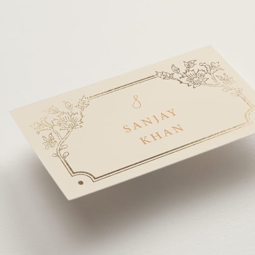 This is a ochre wedding place cards with foil pressed by Hannah Bowman called marigold printing on signature in placecard