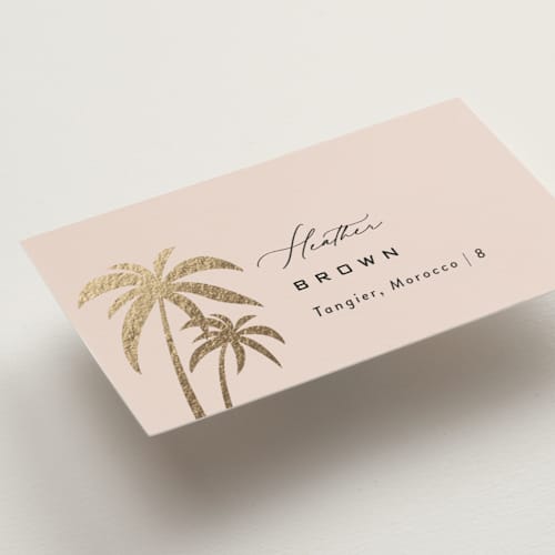 This is a blush wedding place cards with foil pressed by Laura Hamm called tropical getaway printing on signature in placecard