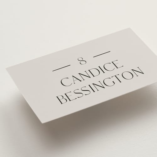 This is a linen wedding place cards with foil pressed by Baumbirdy called floral type arch printing on signature in placecard