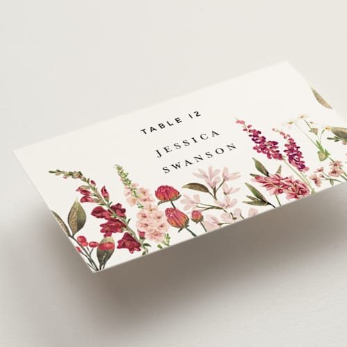 This is a magenta wedding place cards with foil pressed by Susan Moyal called lush printing on signature in placecard