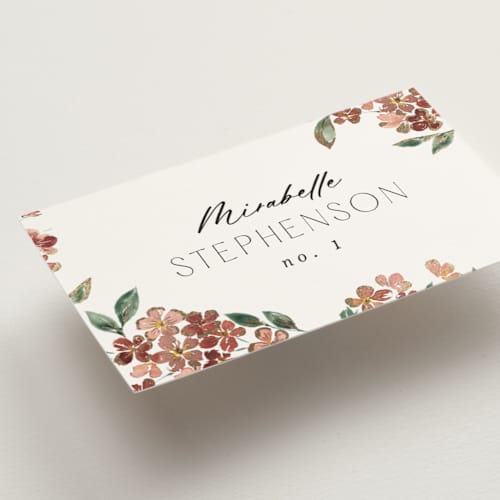This is a dusty rose wedding place cards with foil pressed by Itsy Belle Studio called sweeping vine printing on signature in placecard