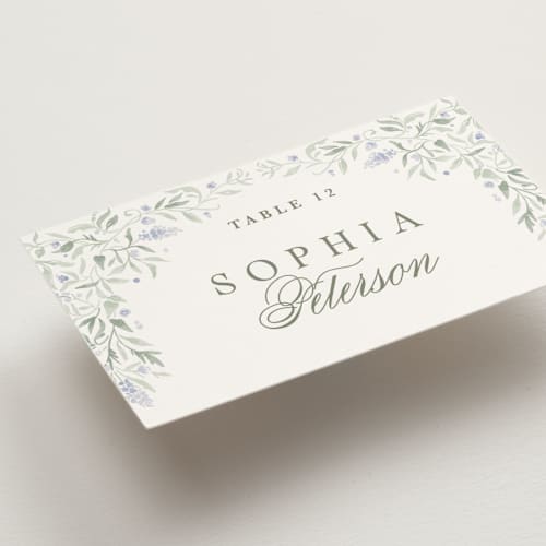 This is a periwinkle wedding place cards with standard by Kristen Smith called delicate vines printing on signature in placecard