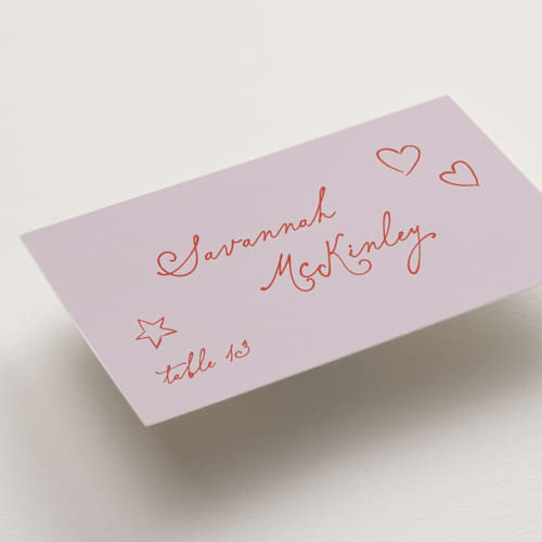 This is a lavender wedding place cards with standard by Kelly Watkins called whimsical printing on signature in placecard