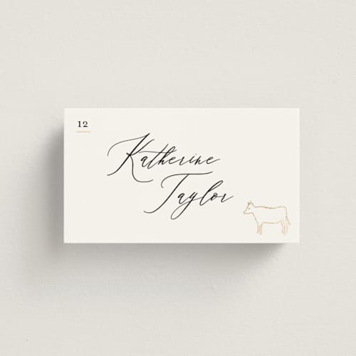 This is a ivory wedding place cards with foil pressed by Creo Study called gilded icons printing on signature in placecard