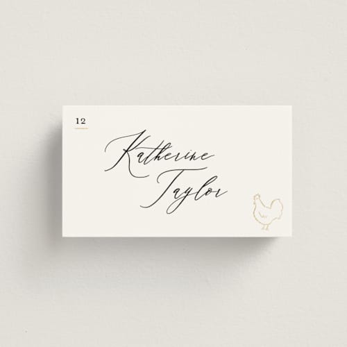 This is a ivory wedding place cards with foil pressed by Creo Study called gilded icons printing on signature in placecard
