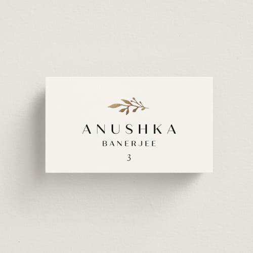 This is a black dahlia wedding place cards with foil pressed by Olivia Raufman called petite sprig printing on signature in placecard