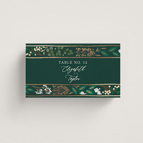 This is a evergreen wedding place cards with foil pressed by Alethea and Ruth called illuminated storybook printing on signature in placecard
