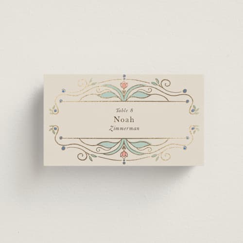 This is a ivory wedding place cards with foil pressed by Maria Hilas-Louie called ornate elegance printing on signature in placecard