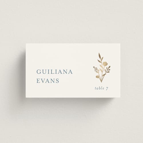 This is a dusty blue wedding place cards with foil pressed by Jennifer Postorino called wildflower printing on signature in placecard