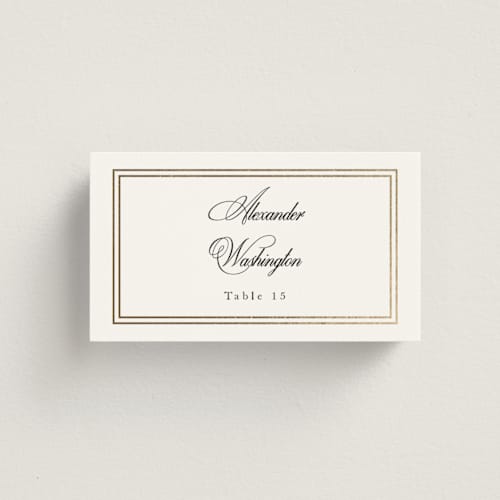 This is a snow wedding place cards with foil pressed by Sarah Brown called traditionalist printing on signature in placecard