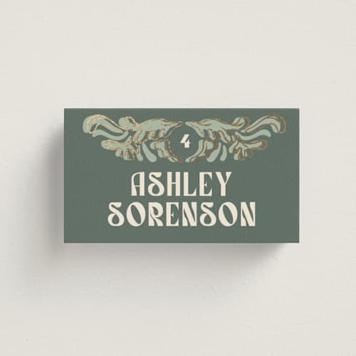 This is a sage wedding place cards with foil pressed by GeekInk Design called nouveau frame printing on signature in placecard