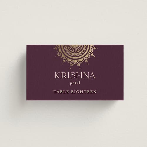This is a plum wedding place cards with foil pressed by Randi Cirelli called arunima printing on signature in placecard
