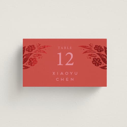 This is a ruby wedding place cards with foil pressed by Ghia Designs called fiery printing on signature in placecard