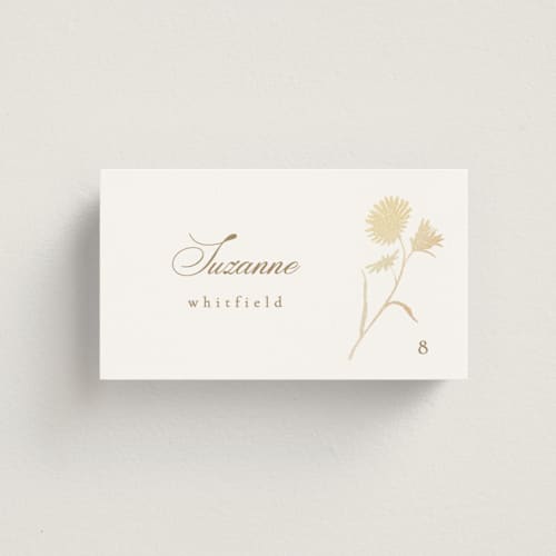 This is a buttercream wedding place cards with foil pressed by Kristie Kern called the romantic printing on signature in placecard