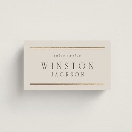 This is a champagne wedding place cards with foil pressed by Nicole Walsh called grace printing on signature in placecard