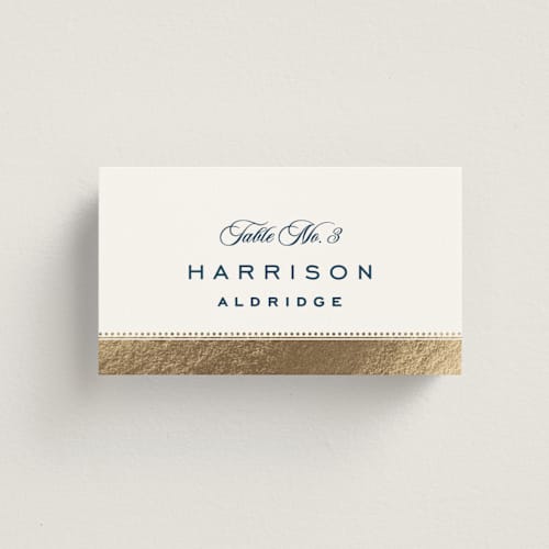 This is a royal navy wedding place cards with foil pressed by Olivia Raufman called anchored printing on signature in placecard