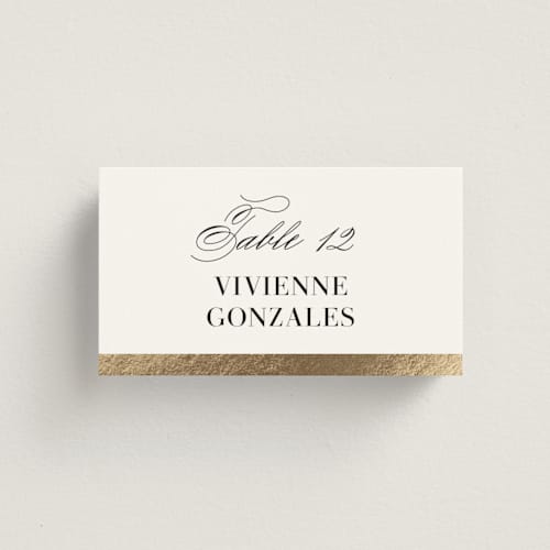 This is a cotton wedding place cards with foil pressed by Jennifer Postorino called gilded ampersand printing on signature in placecard