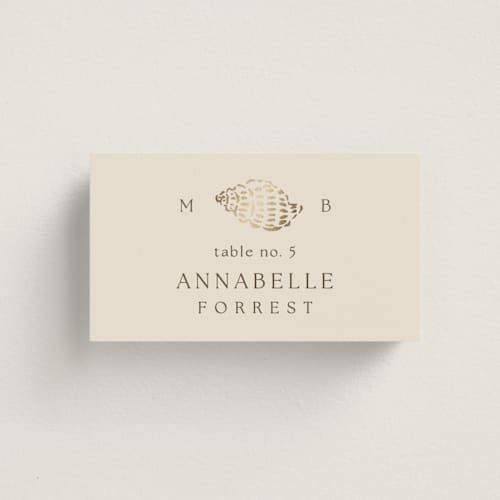 This is a champagne wedding place cards with foil pressed by Griffinbell Paper Co. called seaside printing on signature in placecard