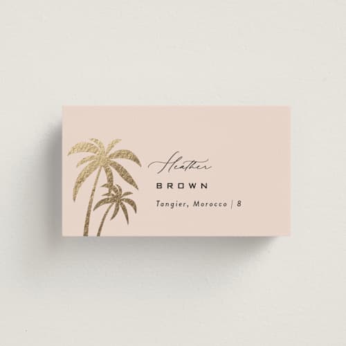 This is a blush wedding place cards with foil pressed by Laura Hamm called tropical getaway printing on signature in placecard