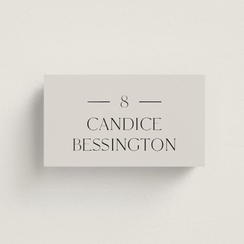 This is a linen wedding place cards with foil pressed by Baumbirdy called floral type arch printing on signature in placecard